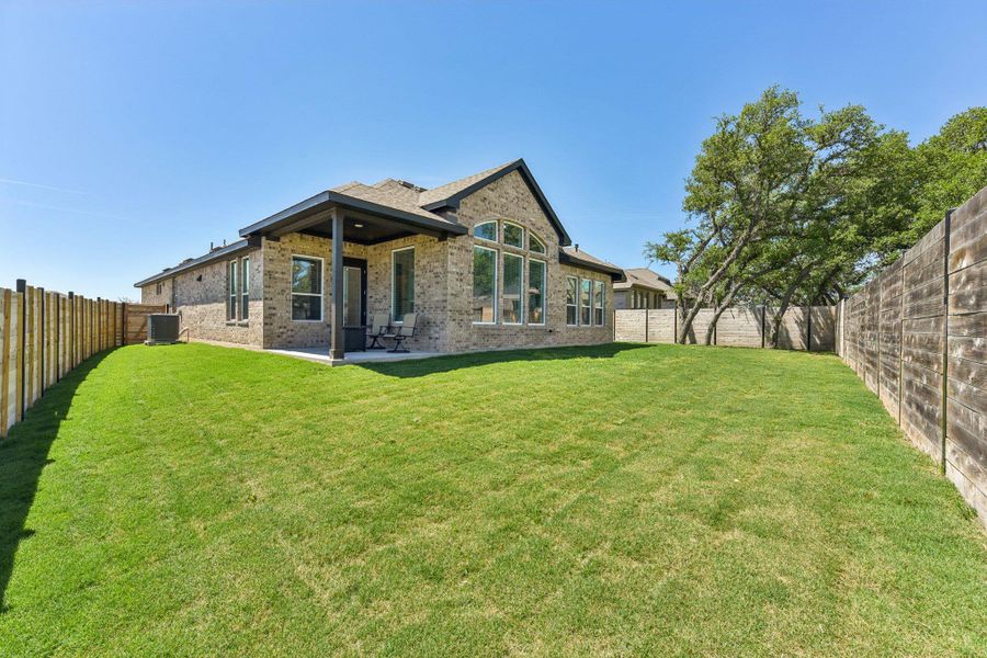Exterior details and patio area of a home in Highland Village, Georgetown (Image 3).