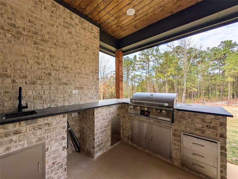 View of patio / terrace with a sink and an outdoor kitchen