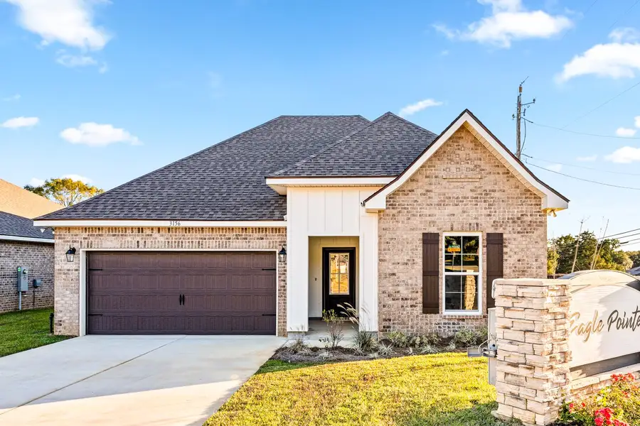 Front exterior of a new home in Eagle Pointe, Pensacola, FL, highlighting curb appeal (Image 1). Front exterior of a new home in Eagle Pointe, Pensacola, FL, highlighting curb appeal (Image 1).
