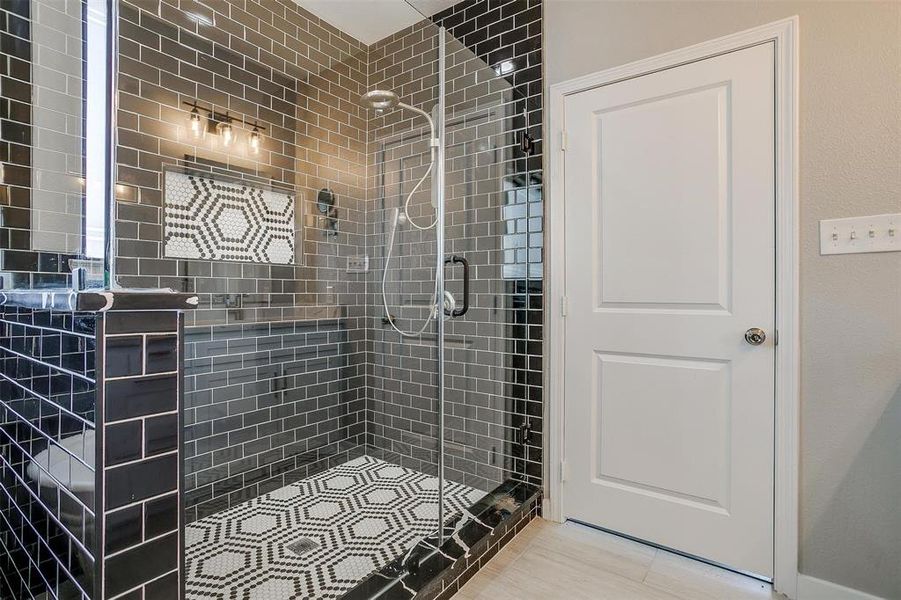 Bathroom with a shower with door