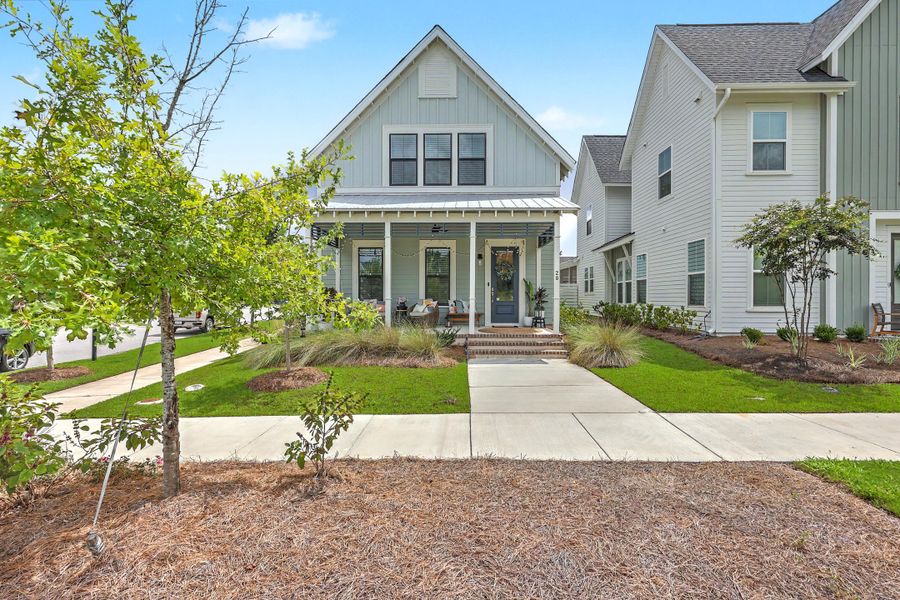 Front exterior of a new home in Nexton - Midtown, Summerville, SC, highlighting curb appeal (Image 26). Front exterior of a new home in Nexton - Midtown, Summerville, SC, highlighting curb appeal (Image 26).