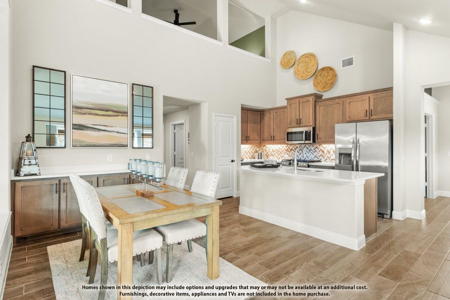 Open-plan dining area and kitchen with wood cabinets, stainless appliances, and high ceilings over wood-look tile floors. Open-plan dining area and kitchen with wood cabinets, stainless appliances, and high ceilings over wood-look tile floors.
