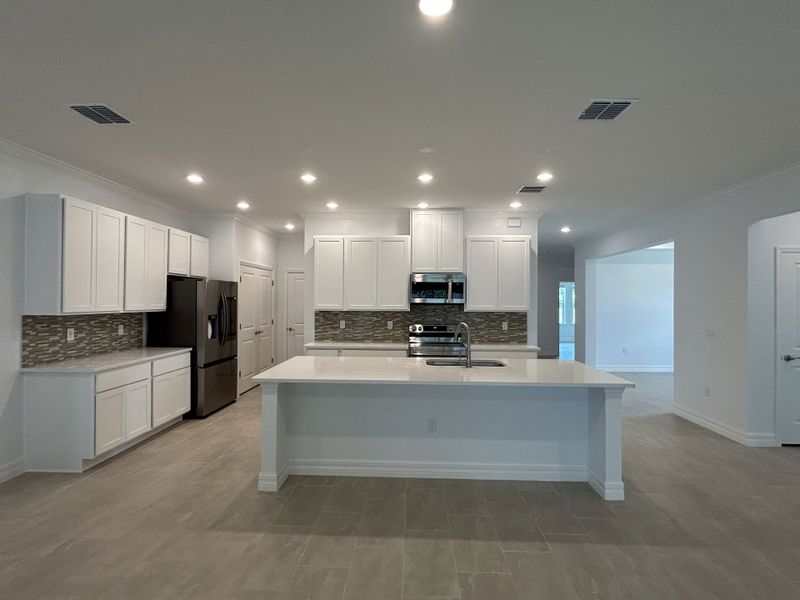 Furnished interior view inside a new home in Burnt Store, Cape Coral (Image 8). Furnished interior view inside a new home in Burnt Store, Cape Coral (Image 8).