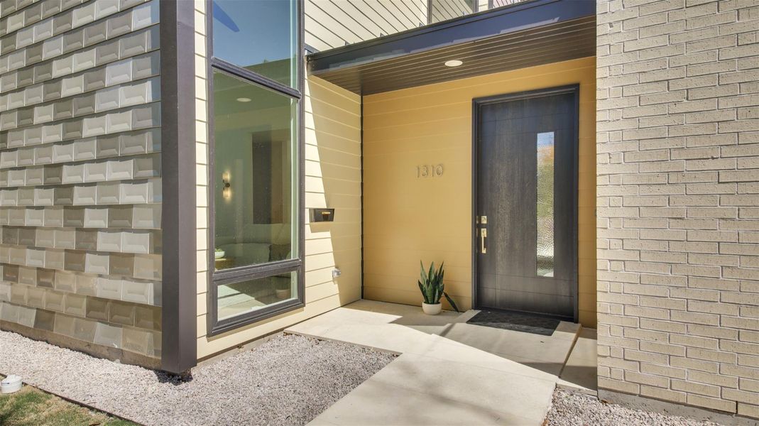 Entrance to property with brick siding
