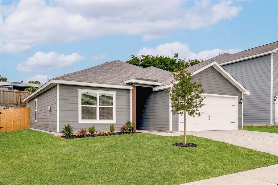 Ranch-style house with driveway and a garage