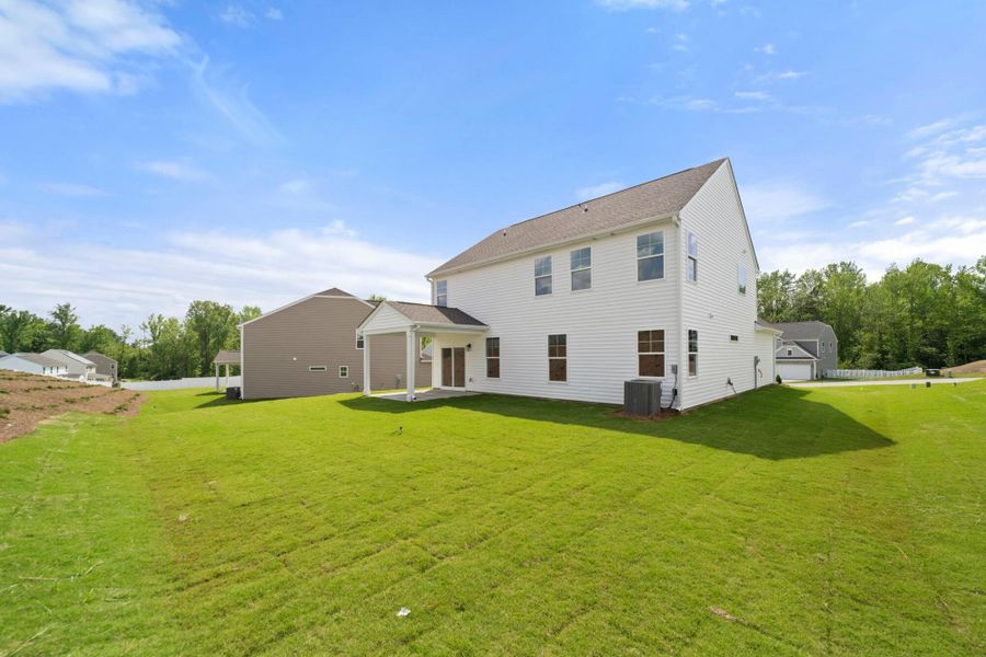 Front exterior of a new home in Cottages at Piper Village, Trinity, NC, highlighting curb appeal (Image 23).