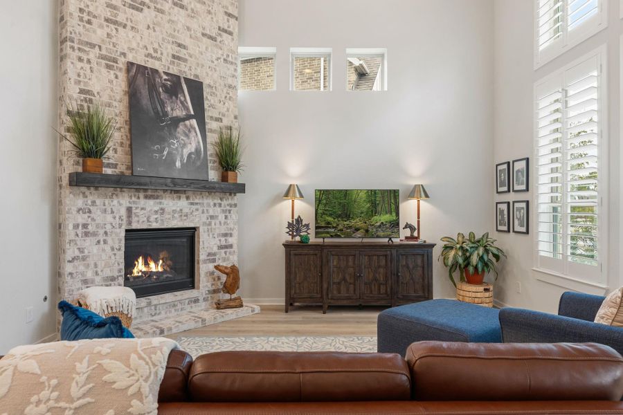 Brick fireplace extends all the way to the ceiling - enjoy the gas log fireplace on cool Texas nights!