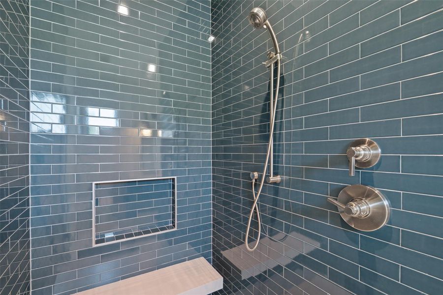 Full bathroom featuring a tile shower