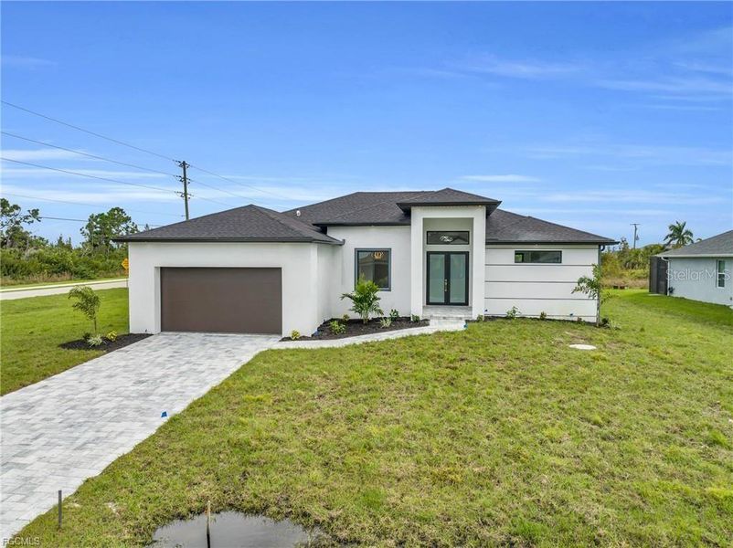 Front exterior of a new home in , Port Charlotte, FL, highlighting curb appeal (Image 16).
