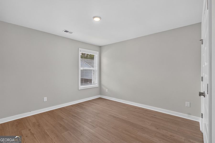 Spacious, unfurnished interior of a new home in The Cottages at East Lanier, Fayetteville (Image 15).