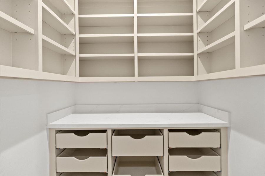 This pantry is designed to keep your life organized and effortless. Floor-to-ceiling shelving and deep drawers give you room for everything—from bulk groceries to small appliances—so your kitchen stays clean, uncluttered, and ready for whatever the day throws at you.