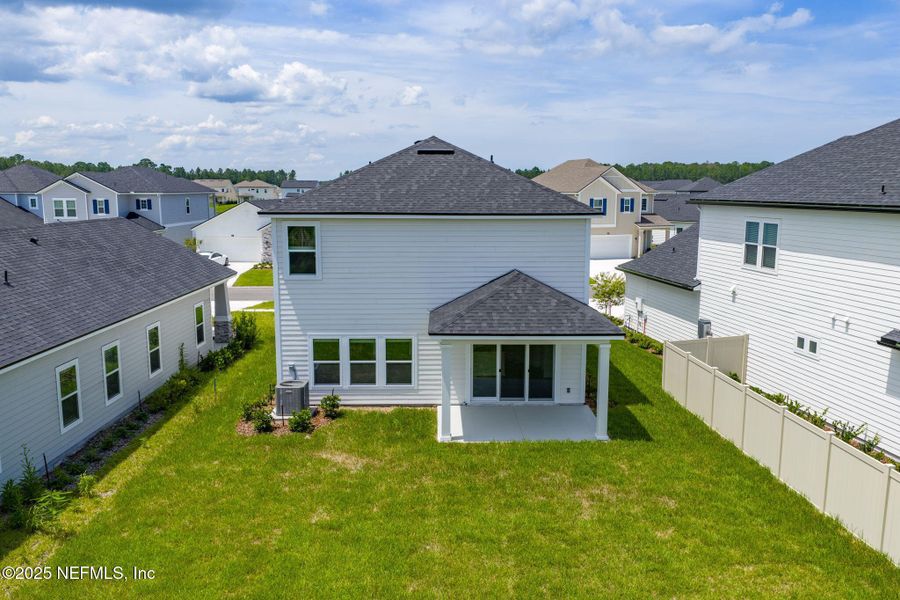 Front exterior of a new home in Beacon Lake, St. Augustine, FL, highlighting curb appeal (Image 20).