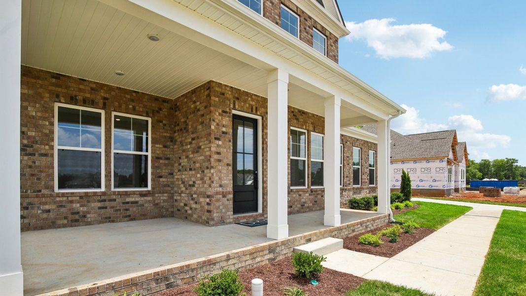 Exterior front entryway with covered porch Exterior front entryway with covered porch
