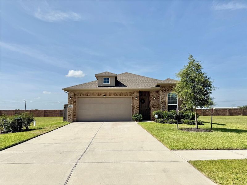 Front exterior of a new home in , Angleton, TX, highlighting curb appeal (Image 28).