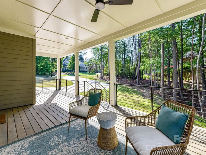 Spacious covered deck overlooking a private wooded backdrop, perfect for relaxing, entertaining, and enjoying peaceful outdoor living year-round. Spacious covered deck overlooking a private wooded backdrop, perfect for relaxing, entertaining, and enjoying peaceful outdoor living year-round.