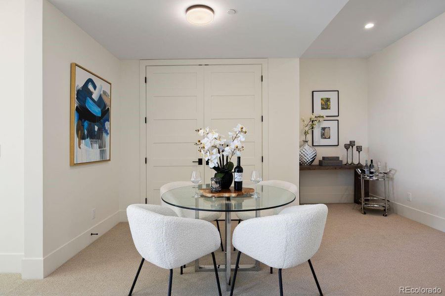 The sizeable lower level offers space for a separate dining or gaming area.