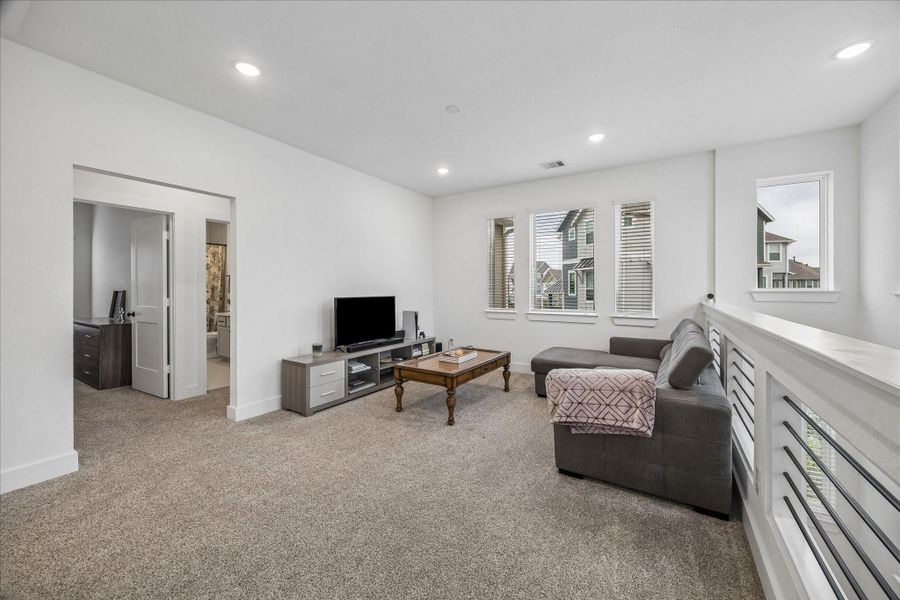 The secondary bedrooms are thoughtfully tucked away along a private hallway with full bathroom.