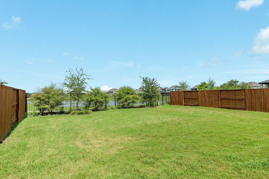 Oversized backyard retreat featuring expansive space perfect for building your own custom oasis or simply relaxing while admiring the serene lake views.