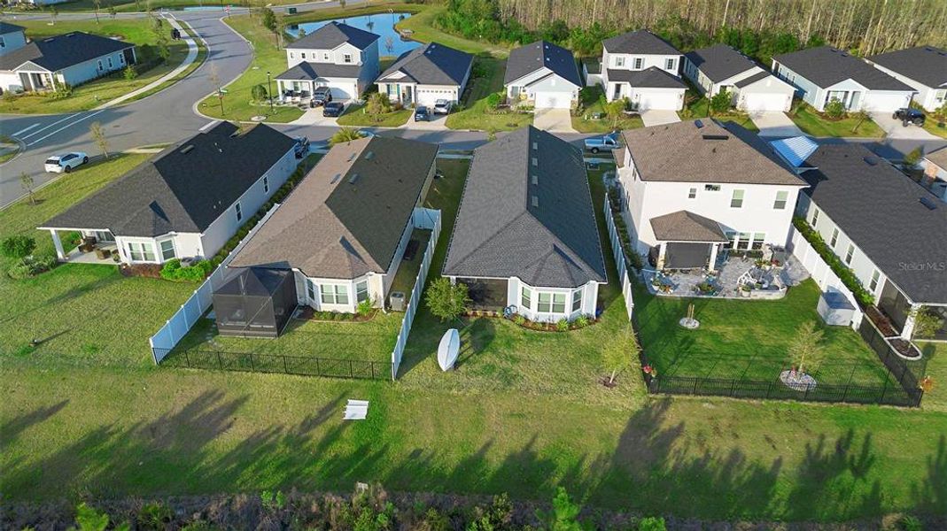 An aerial view of this perfectly maintained property reveals its pristine condition, set within a well-kept community of like-minded neighbors, creating a harmonious and inviting environment.