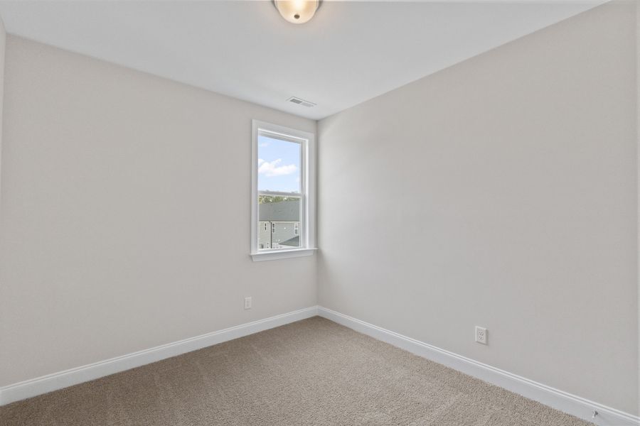 Representative unfurnished interior of a home built from the The Juniper by RobuckHomes in Kennebec Crossing, Angier (Image 118).