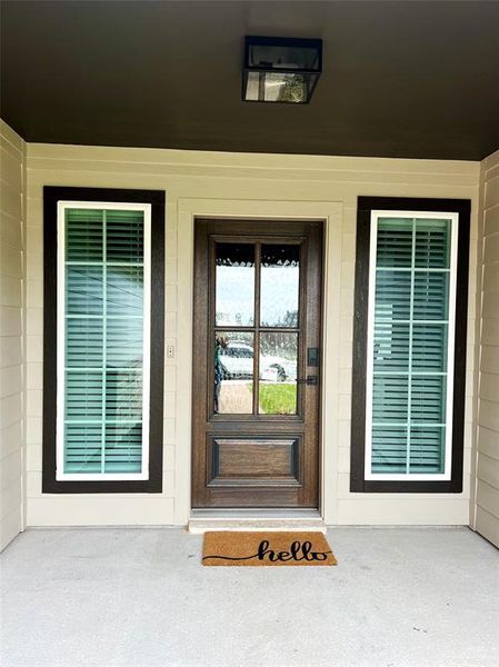 Doorway to property featuring covered porch Doorway to property featuring covered porch