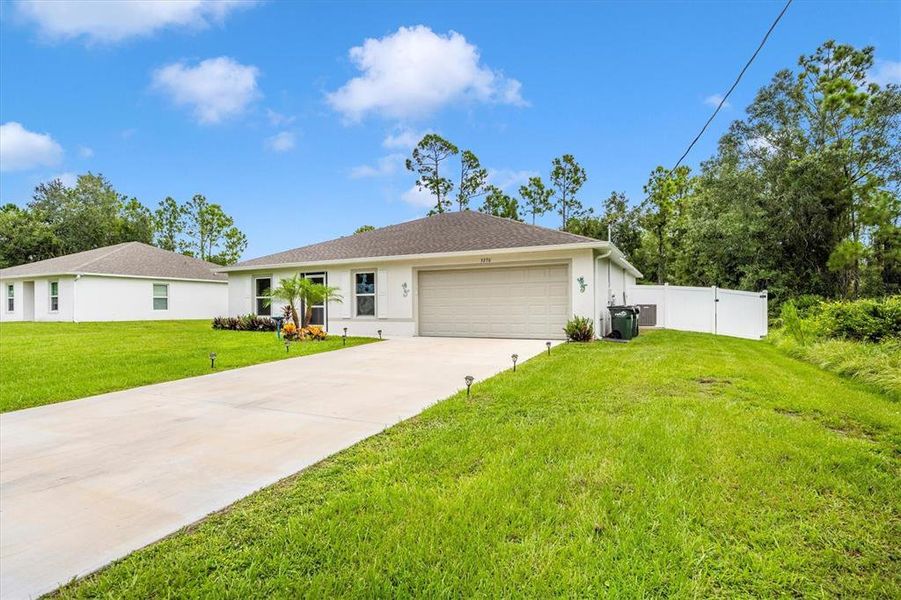 Front exterior of a new home in , North Port, FL, highlighting curb appeal (Image 19). Front exterior of a new home in , North Port, FL, highlighting curb appeal (Image 19).