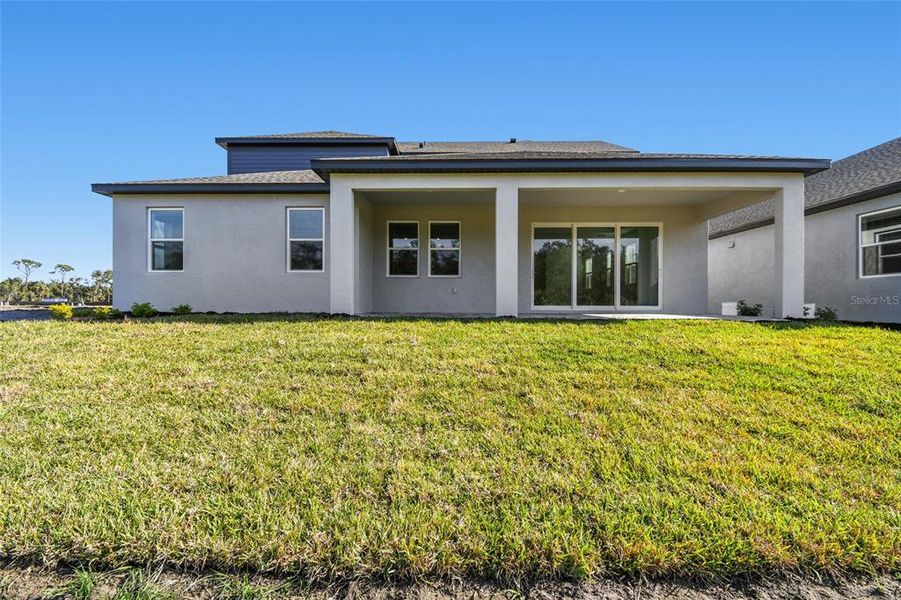 Exterior details and patio area of a home in Creeks Edge at Twin Rivers, Parrish (Image 4).