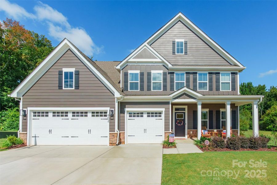 Front exterior of a new home in , Indian Trail, NC, highlighting curb appeal (Image 18).