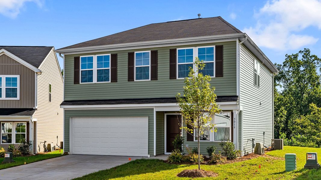 Front exterior of a new home in Bell West, Kernersville, NC, highlighting curb appeal (Image 25).