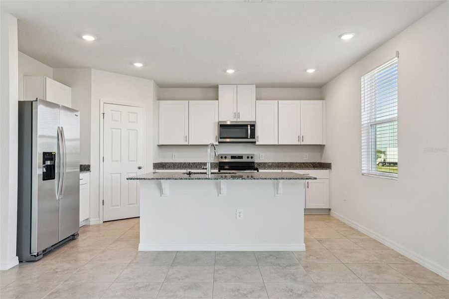 Furnished interior view inside a new home in Lake Deer Estates - Signature Series, Poinciana (Image 7).