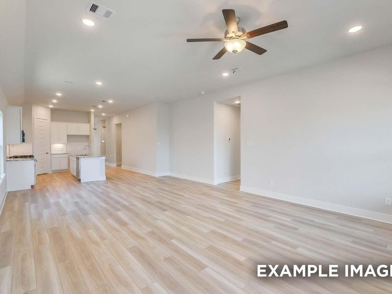 Spacious, unfurnished interior of a new home in Sunterra, Katy (Image 14).