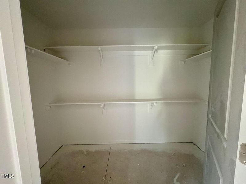 Owners Suite Walk-In Closet 1