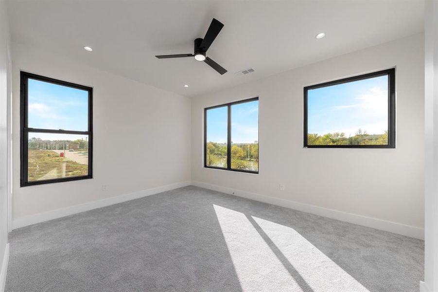 Spare room featuring light colored carpet, a ceiling fan, and recessed lighting Spare room featuring light colored carpet, a ceiling fan, and recessed lighting