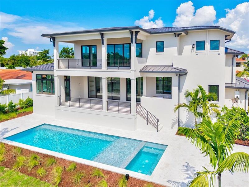 Front exterior of a new home in , Longboat Key, FL, highlighting curb appeal (Image 28). Front exterior of a new home in , Longboat Key, FL, highlighting curb appeal (Image 28).