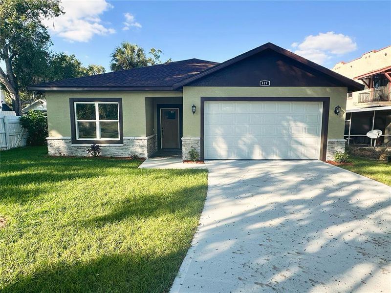 Front exterior of a new home in , Lake Wales, FL, highlighting curb appeal (Image 23).