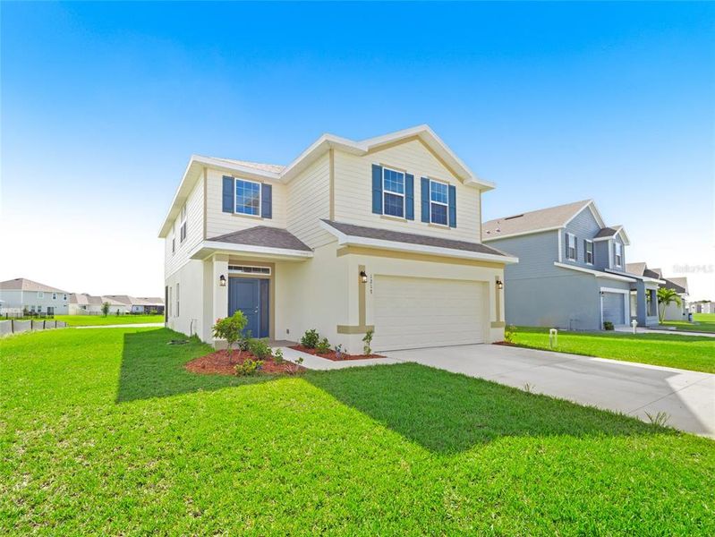 Front exterior of a new home in , Palm Bay, FL, highlighting curb appeal (Image 23). Front exterior of a new home in , Palm Bay, FL, highlighting curb appeal (Image 23).