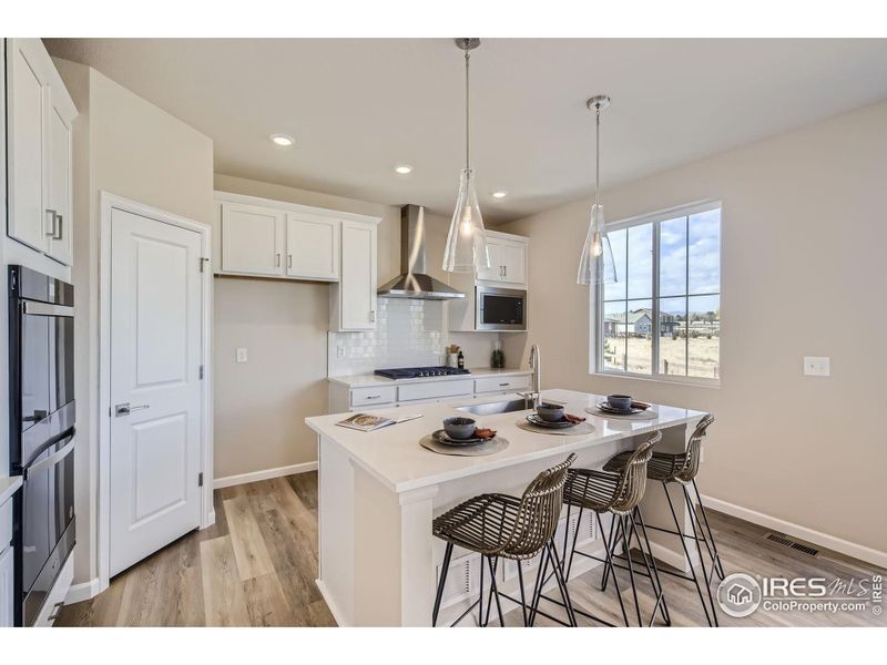 Kitchen *Photo not of actual home, but same floorplan and style*