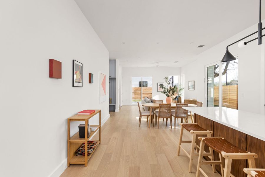 Dining area with light wood-style flooring and baseboards Dining area with light wood-style flooring and baseboards