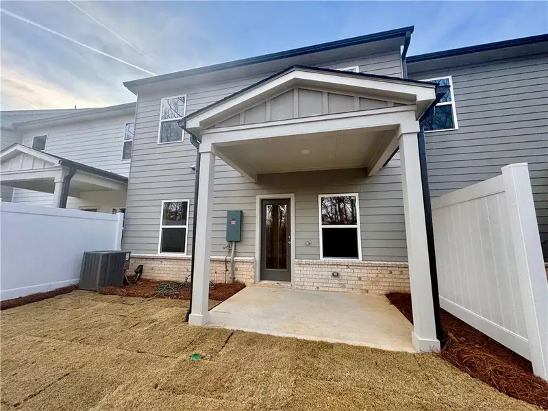 Exterior details and patio area of a home in Eastlyn Crossing, Flowery Branch (Image 4). Exterior details and patio area of a home in Eastlyn Crossing, Flowery Branch (Image 4).