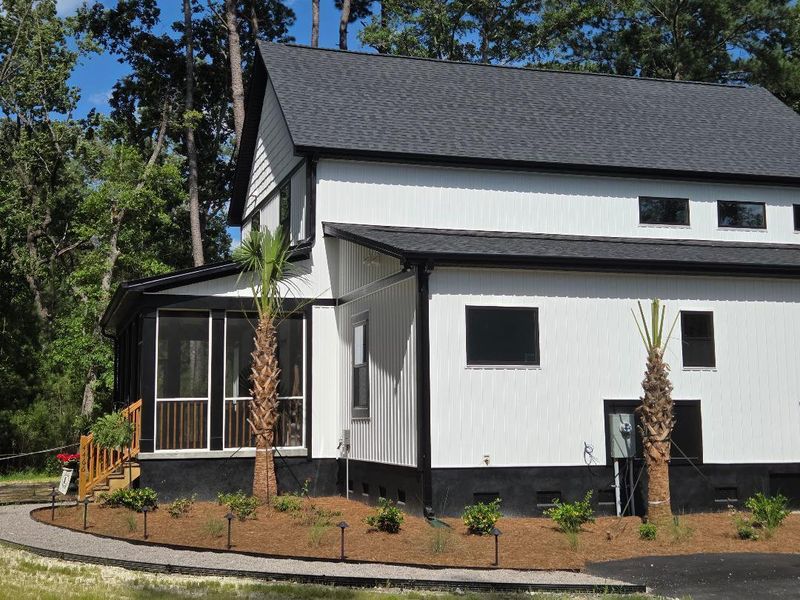 Front exterior of a new home in , Meggett, SC, highlighting curb appeal (Image 1). Front exterior of a new home in , Meggett, SC, highlighting curb appeal (Image 1).