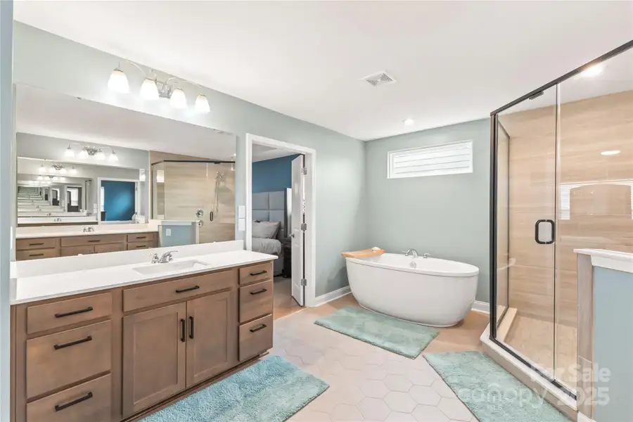 Deep soaking tub to relax away the cares of the day AND separate dual vanities and large corner shower Deep soaking tub to relax away the cares of the day AND separate dual vanities and large corner shower