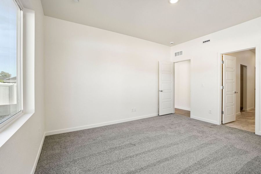 Spacious, unfurnished interior of a new home in Union Colony West, Greeley (Image 25).
