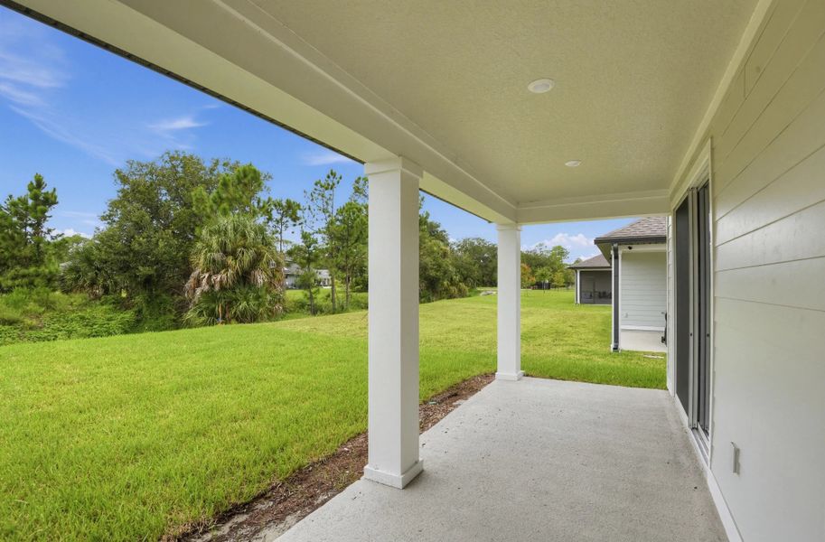 Exterior details and patio area of a home in Ardisia Park, New Smyrna Beach (Image 4).