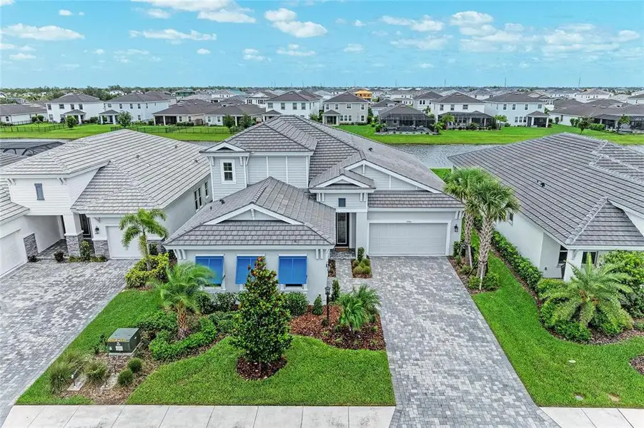 Front exterior of a new home in Star Farms at Lakewood Ranch, Lakewood Ranch, FL, highlighting curb appeal (Image 2). Front exterior of a new home in Star Farms at Lakewood Ranch, Lakewood Ranch, FL, highlighting curb appeal (Image 2).