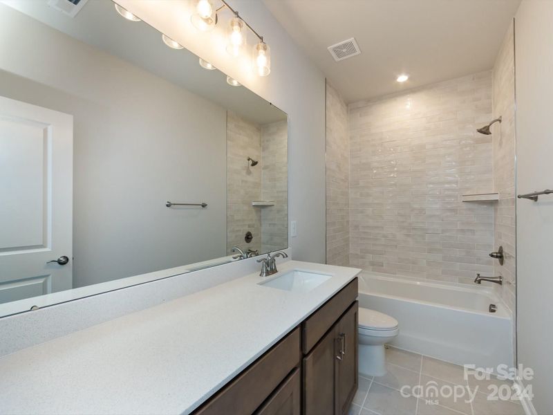 Hallway Full Bath with Tile Walls