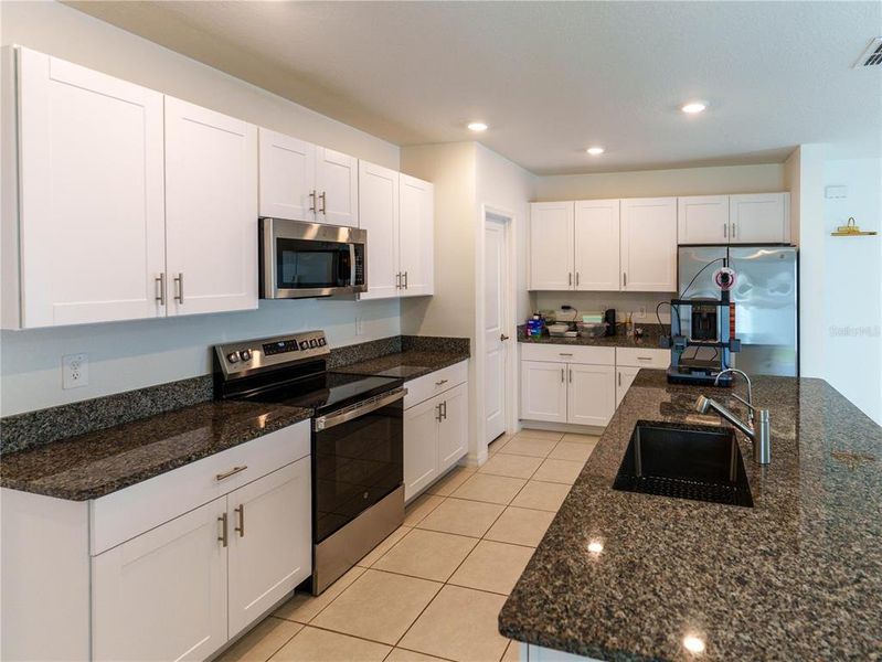 Furnished interior view inside a new home in The Isle of Avalon, Spring Hill (Image 8).