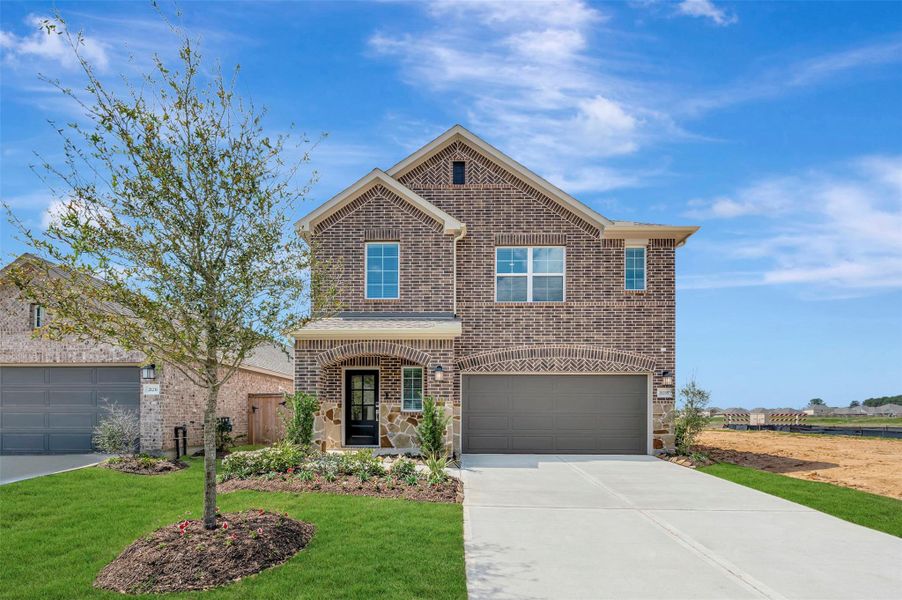 Front exterior of a new home in Sorella, Tomball, TX, highlighting curb appeal (Image 19).