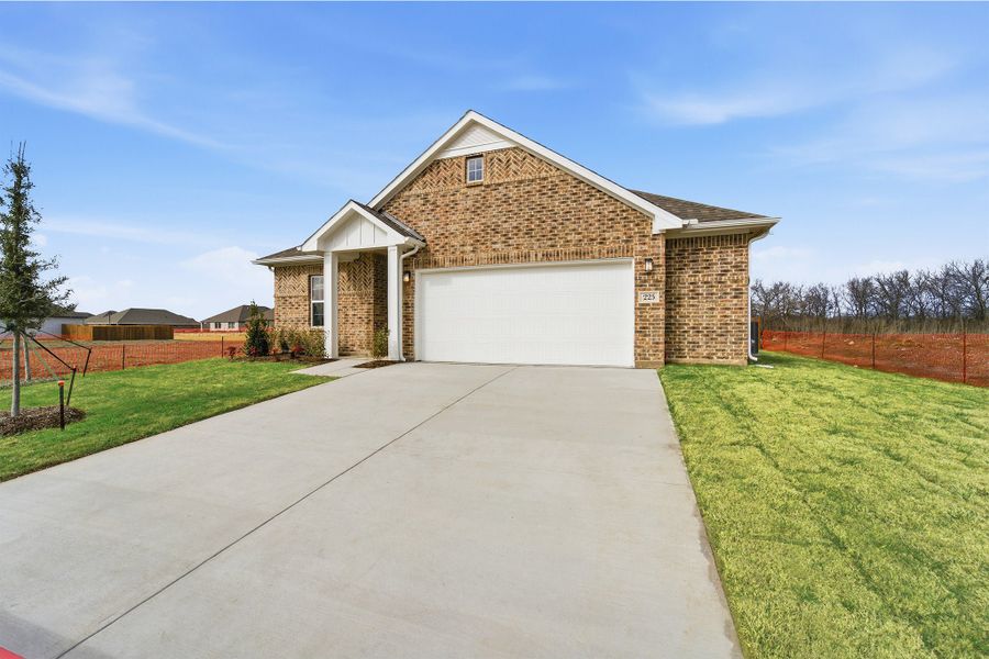 Front exterior of a new home in Saddlebrook Estates, Waxahachie, TX, highlighting curb appeal (Image 2). Front exterior of a new home in Saddlebrook Estates, Waxahachie, TX, highlighting curb appeal (Image 2).