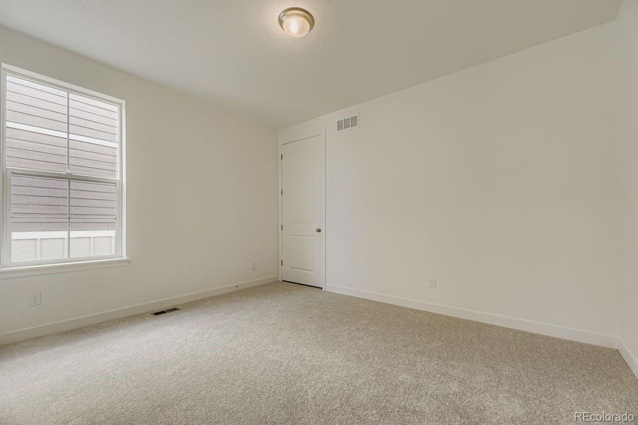 Spacious, unfurnished interior of a new home in Newlin Crossing: The Monarch Collection, Parker (Image 14).