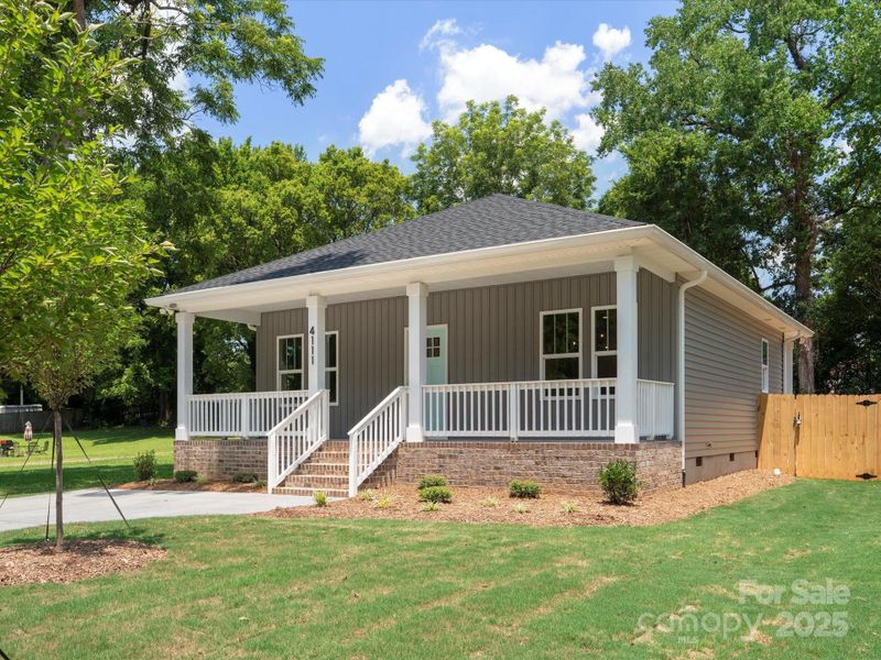 Front exterior of a new home in , Charlotte, NC, highlighting curb appeal (Image 1).